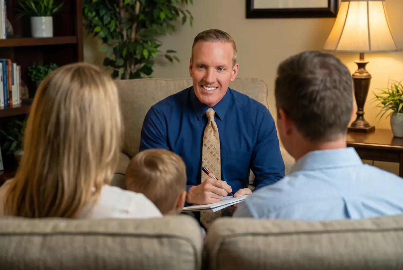 Dr. Carosso consulting with a family in his office